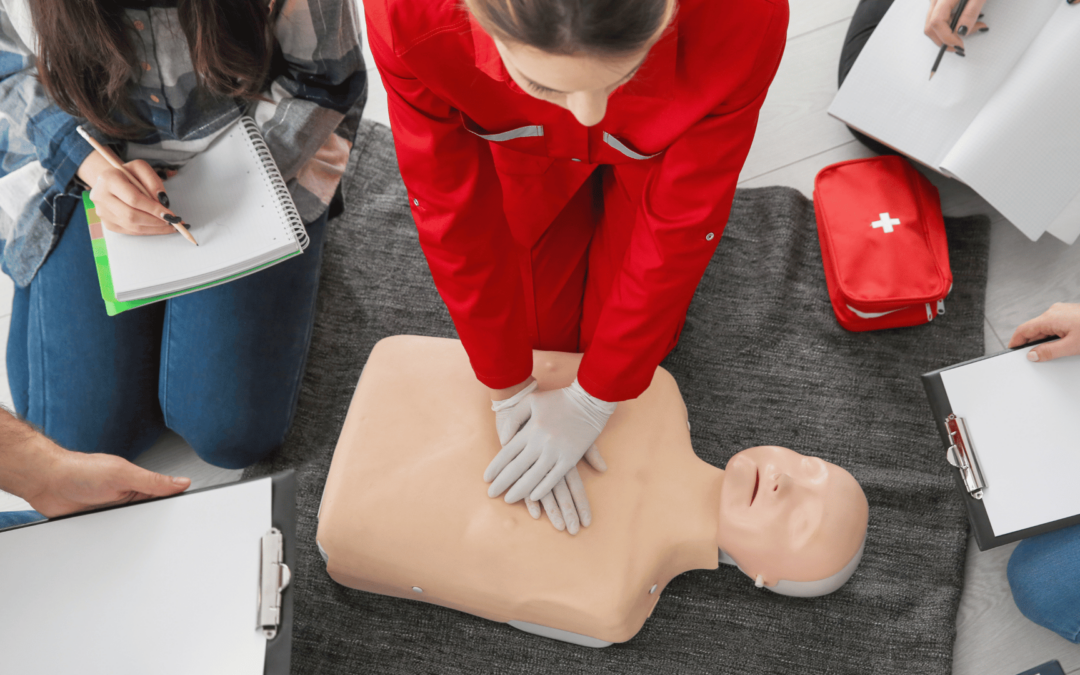 certified instructor showing proper CPR during hands on training for BLS Certification in San Diego.