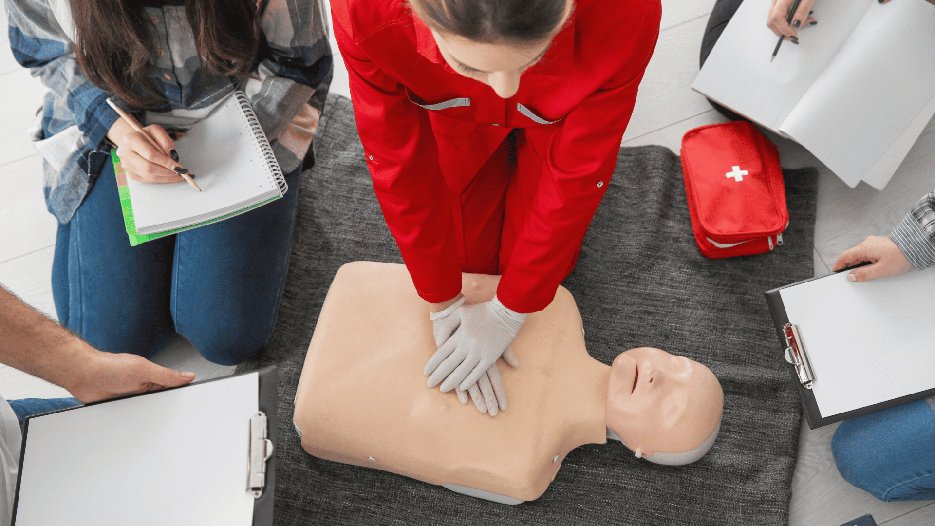 certified instructor showing proper CPR during hands on training for BLS Certification in San Diego.